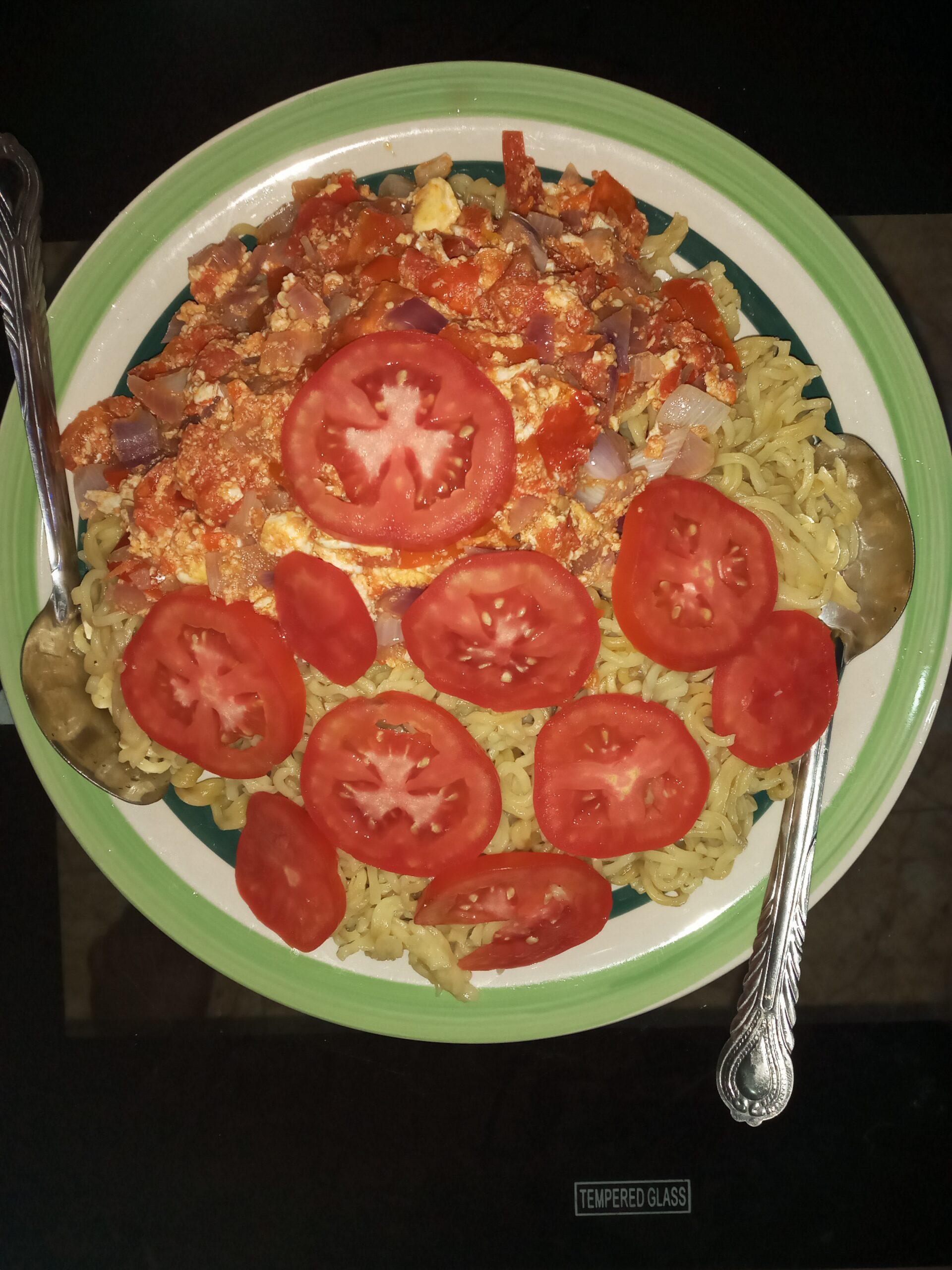 Fried Noodles Garnished with Fresh Tomatoes.